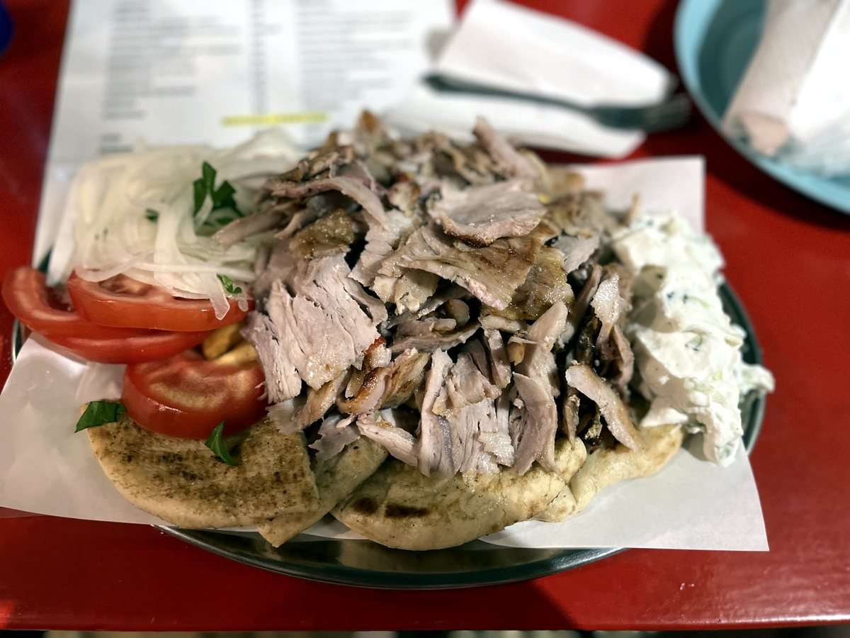 Gyros plate with pita, fries, tomato, onion and tzatziki