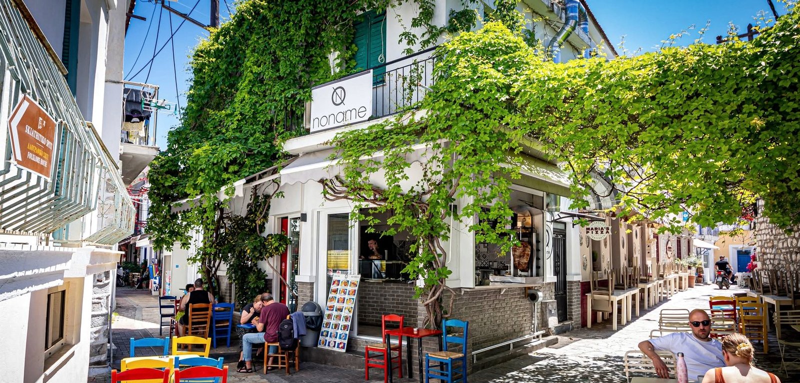 No Name Gyro Pita storefront on a leafy street in Skiathos Town